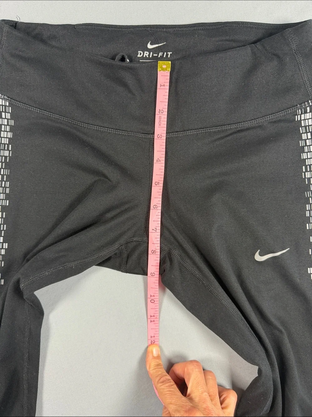 Nike Black dry fit Women’s Leggings with White Side  reflective Mosaic Print.